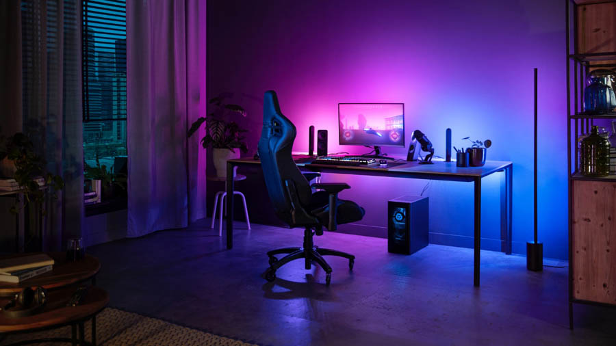 Image of a gaming setup with purple and blue lighting.