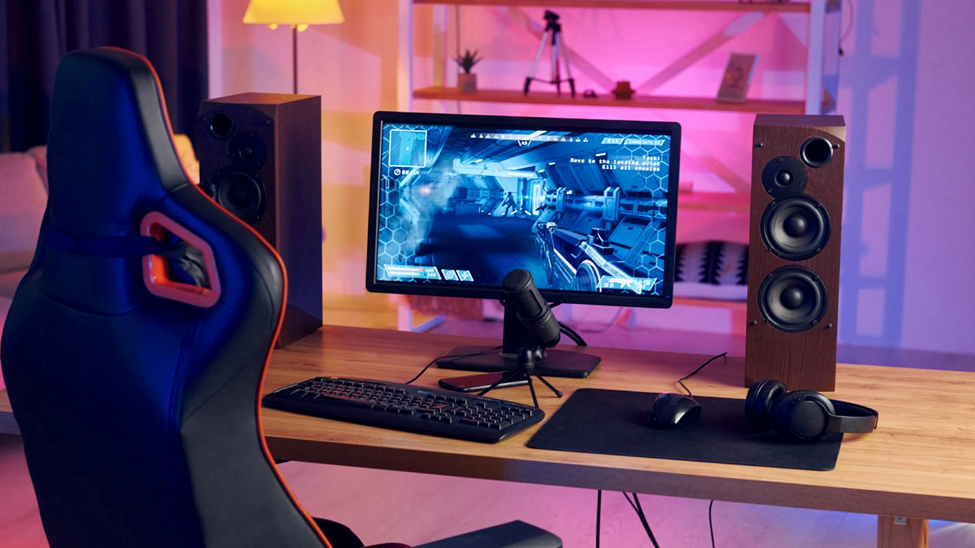 a gaming room with pink light in the background. 
