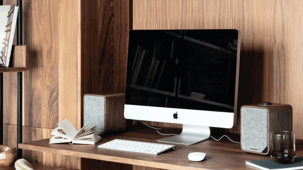  an iMac in a wooden room. 
