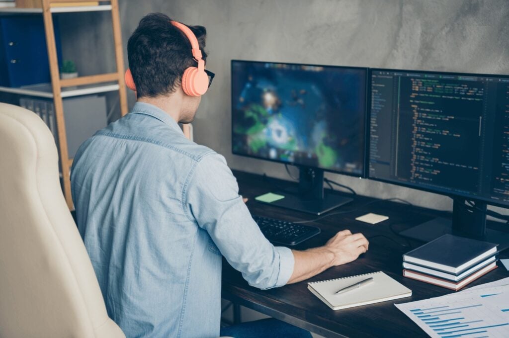 an image of a game developer behind his desk
