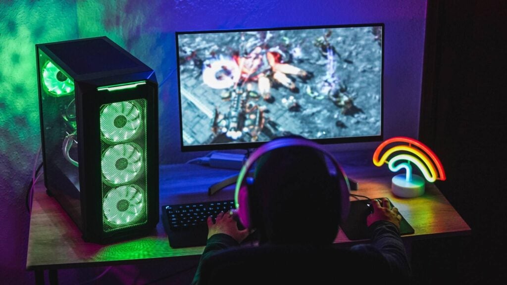 an image of a person playing with his Gaming Computer