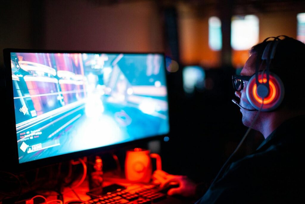 a picture of a gamer playing video games