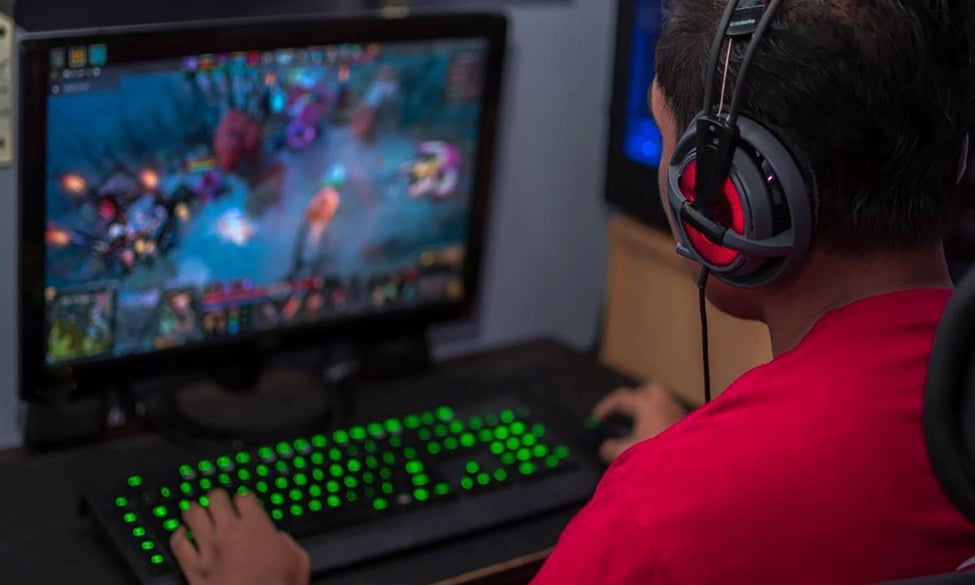a picture of a gamer playing a video game