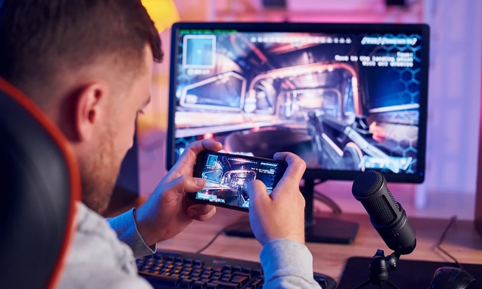 an image of a young man playing with his smartphone