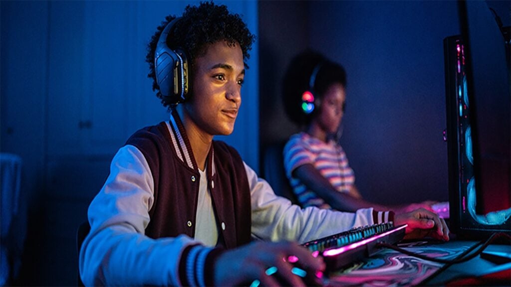 an image of two player behind their gaming computers