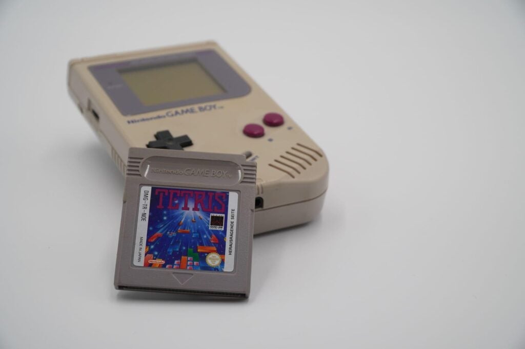 a picture of Gameboy with Tetris Cartridge near it